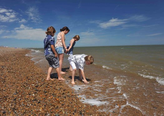 Aldeburgh Beach, Family Playing with Tide