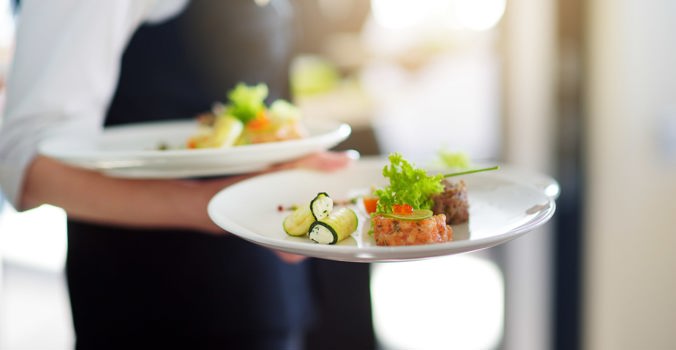 Thorpeness Country Club, waiter carrying plates of food