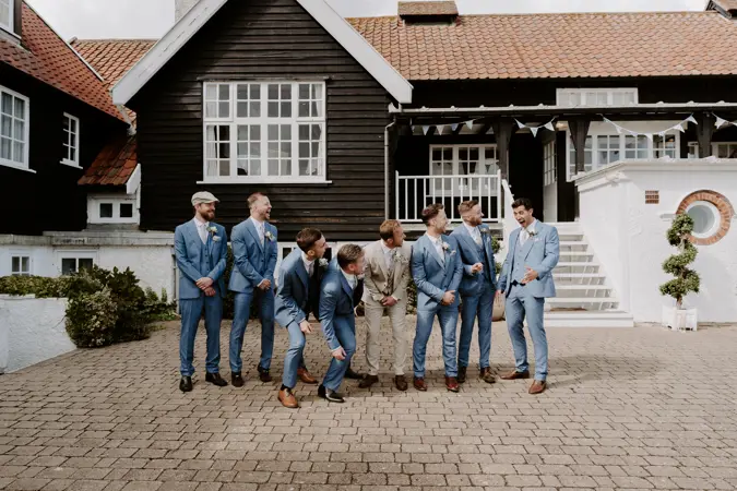 Groom and groomsmen in front of Thorpeness Country Club